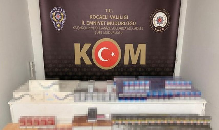 Derince'de araçta yapılan aramada bin 410 paket kaçak sigara ve 90 paket elektronik tütün ele geçirildi