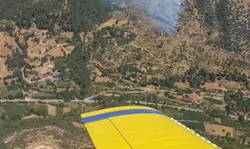 Kiraz'da ziraat arazisinden ormana sıçrayan yangın havadan ve karadan müdahaleyle kontrol altına alındı
